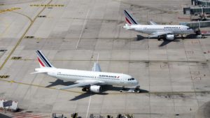 Picture taken on June 27, 2019 shows an Airbus A320 and an Airbus A318 (rear R) airplane of the Air France airline company parked on the tarmac of Roissy-Charles de Gaulle Airport, north of Paris.