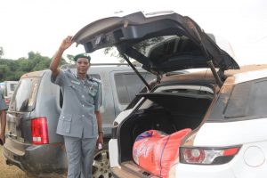 The Nigeria Customs Service, Federal Operations Unit (FOU), Zone A officers with seized contraband.