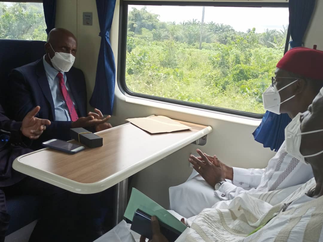 The Minister of Transportation, Chibuike Amaechi and the Delta State Governor, Ifeanyi Okowa on a train in the rail line.
