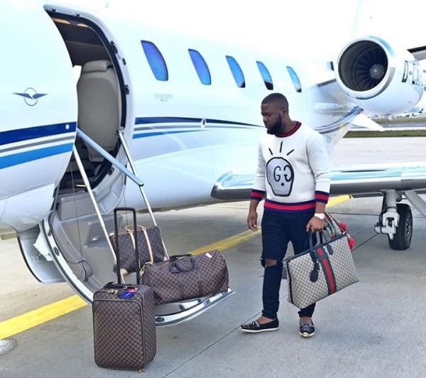 Hushpuppi posing with a private jet